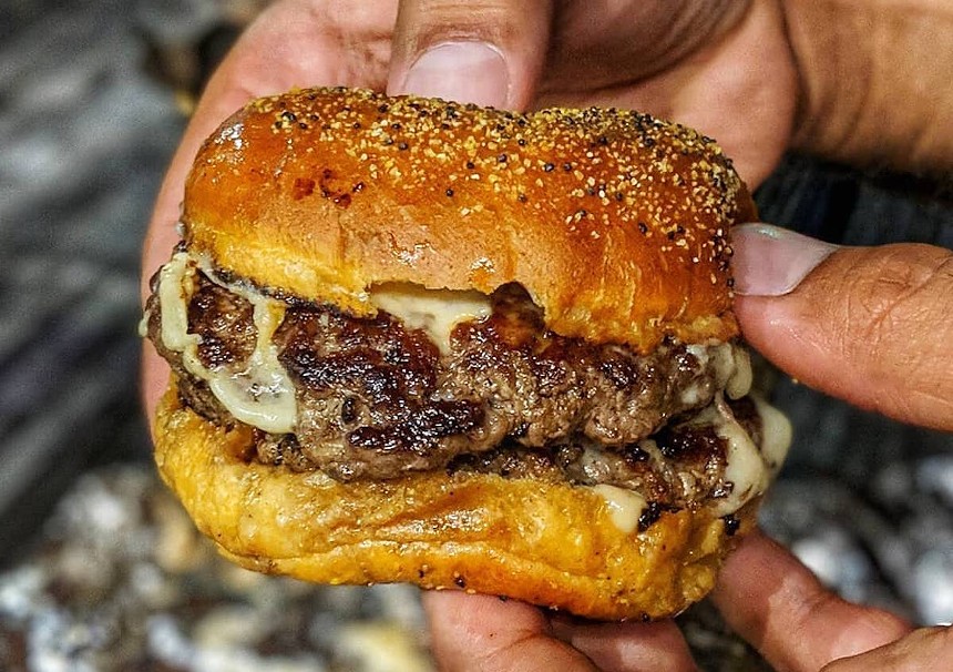 a burger with cheese