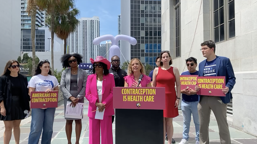 Lawmakers gather around a podium in downtown Miami to speak out in favor of rights to contraception access