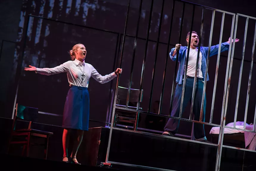 Two performers on stage for Dead Man Walking