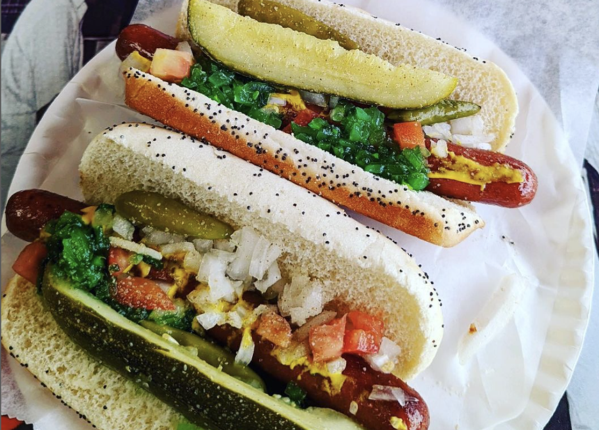 a hot dog with toppings