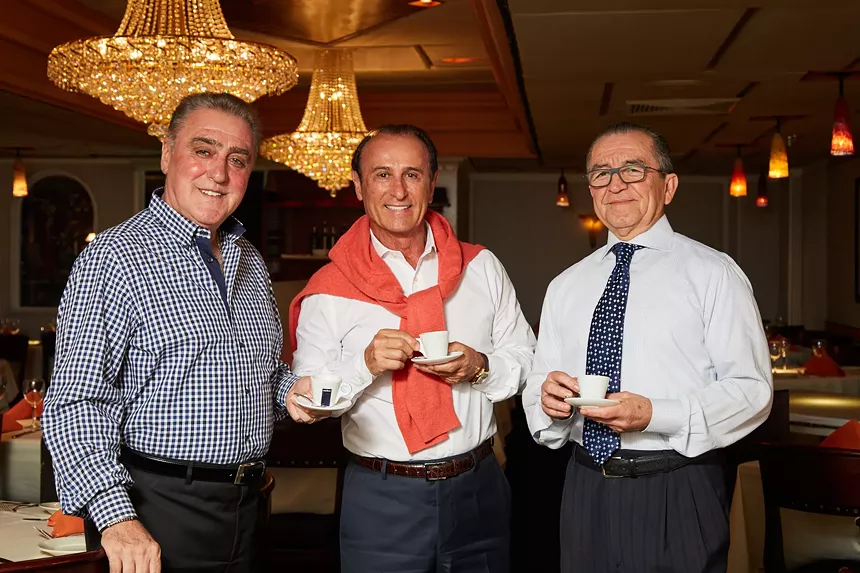 three men posing