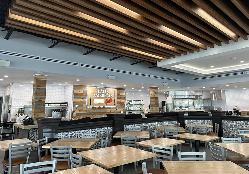 interior dining room with chairs and wood panels