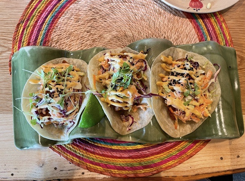 three fish tacos on a plate