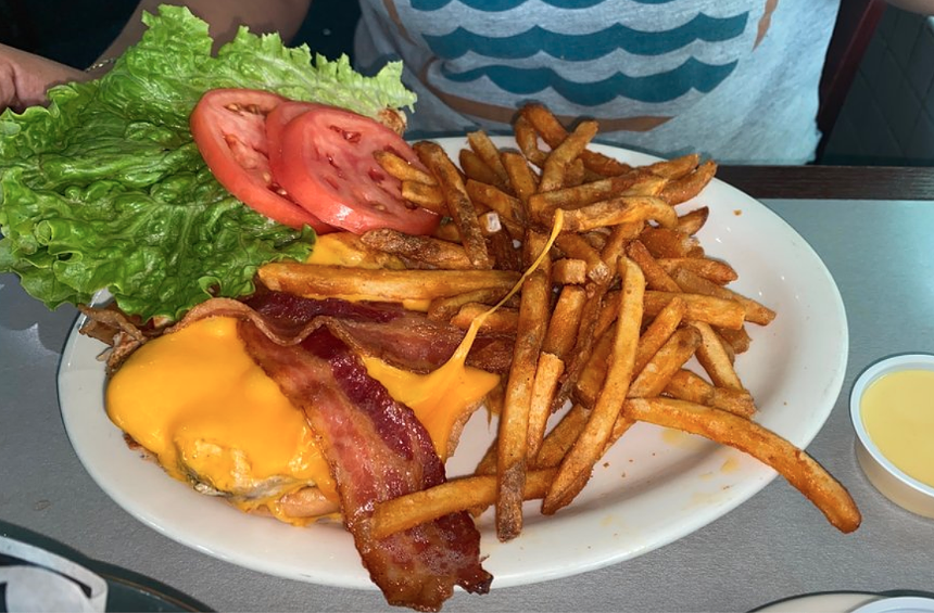 a cheeseburger with fries