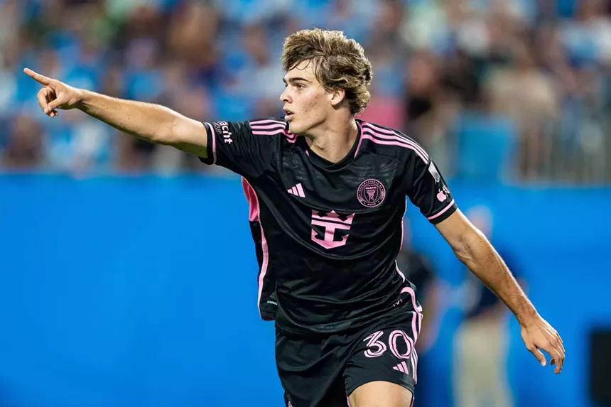 Soccer player Benjamin Cremaschi extends his arm out and points in celebration after scoring a goal