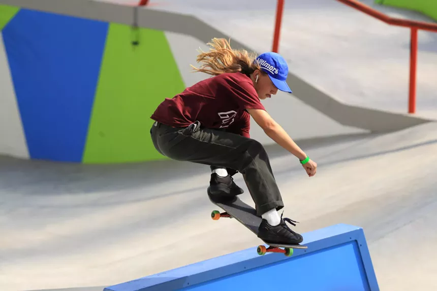 Skateboarder Poe Pinson rides on a street course in Minneapolis
