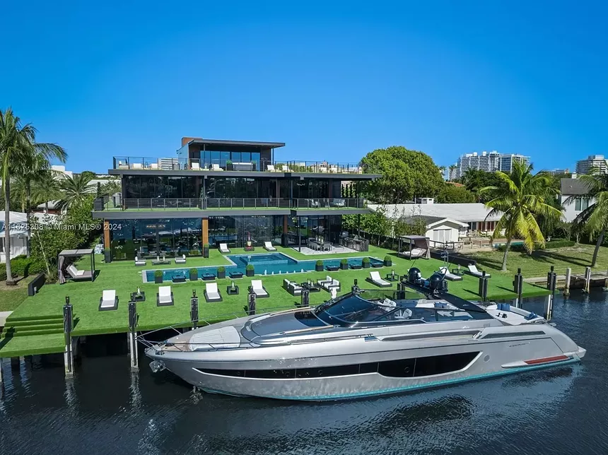 Aerial shot of the backyard of the $48 million mansion and superyacht.