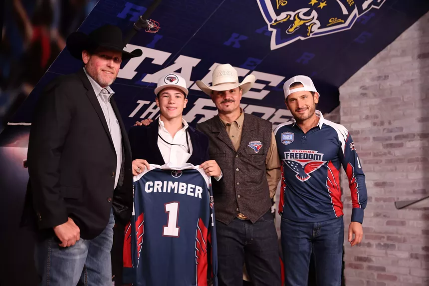 Paulo Crimber poses with his son, John Crimber