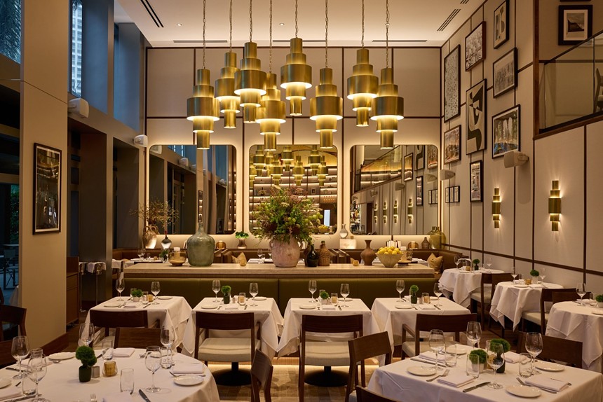 a dining room with chandeliers