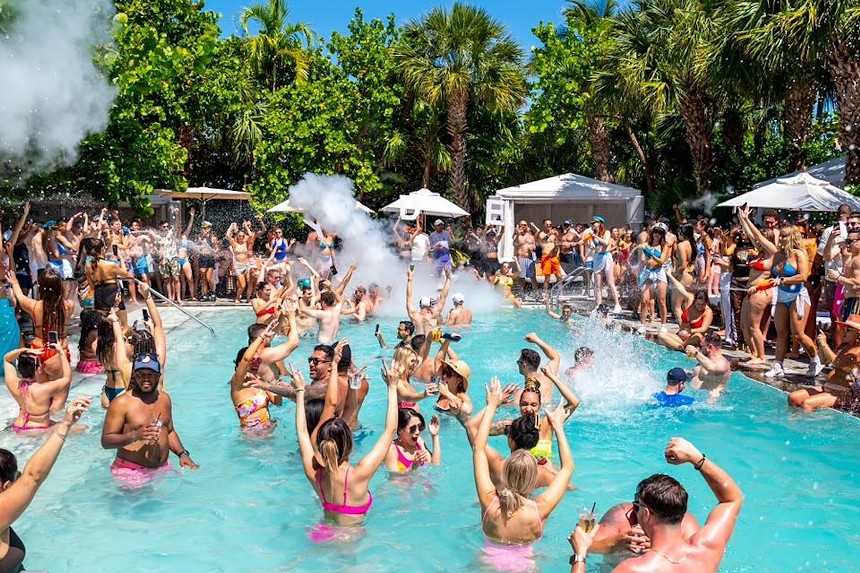 People party in and around the pool at Hyde Beach