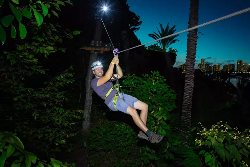 A man ziplining