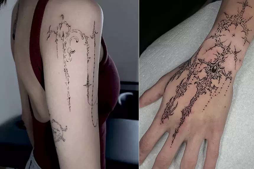 A shoulder and hand tattooed in a cybersigilism style
