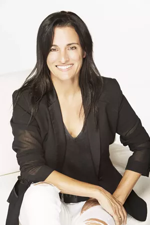 photo of a smiling woman with long dark hair