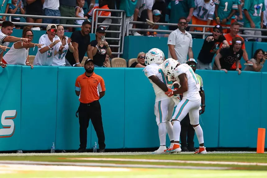 Tyreek Hill #10 and Jaylen Waddle #17 of the Miami Dolphins celebrate after Hill's receiving touchdown during the third quarter against the Jacksonville Jaguars at Hard Rock Stadium on September 8, 2024, in Miami Gardens, Florida.