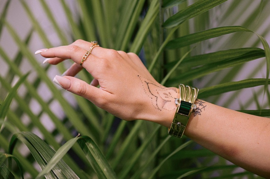 A hand models an ornate bracelet