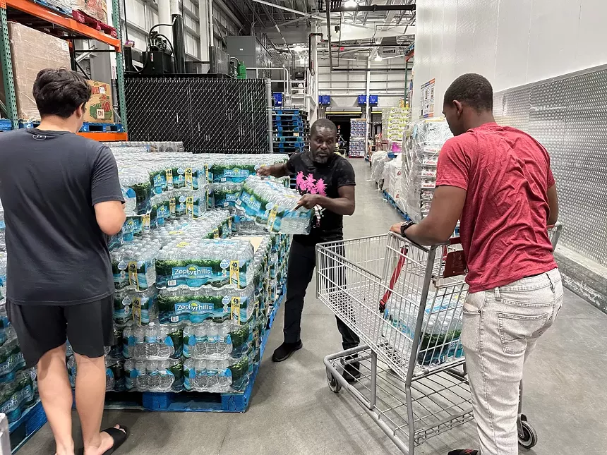Man buying water at Costco in North Miami