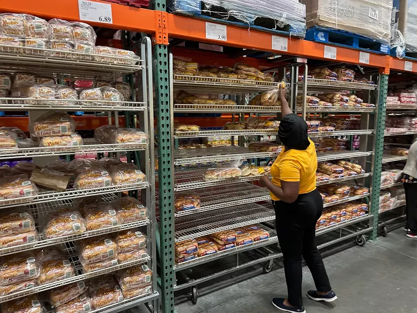 Woman grabs bread at Costco in North Miami
