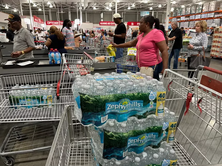 Shopping cart filled with cases of water