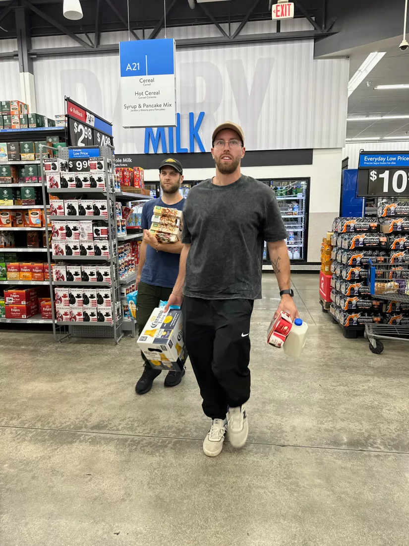Man with hurricane supplies at Walmart