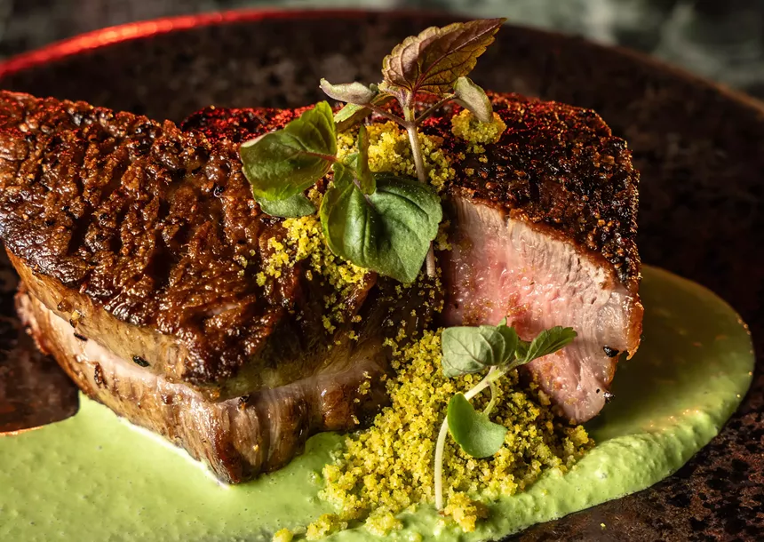 steak over green sauce