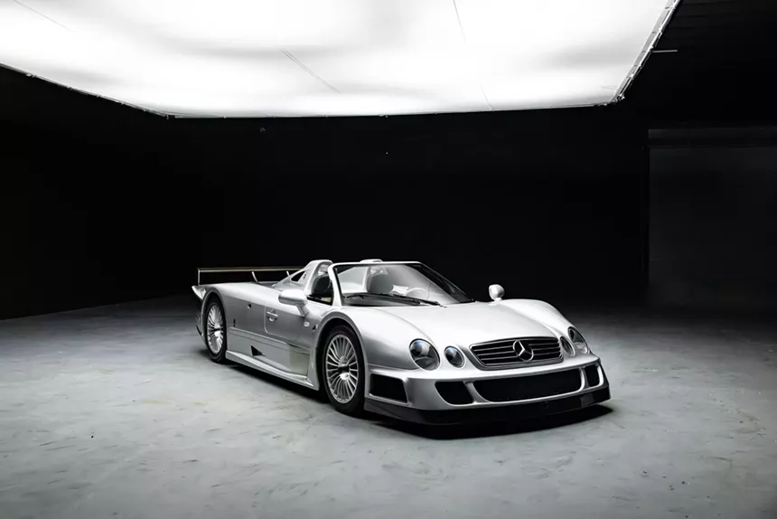 Side angle view of the Mercedes-Benz AMG CLK GTR Roadster highlighting its aerodynamic body and stylish wheels