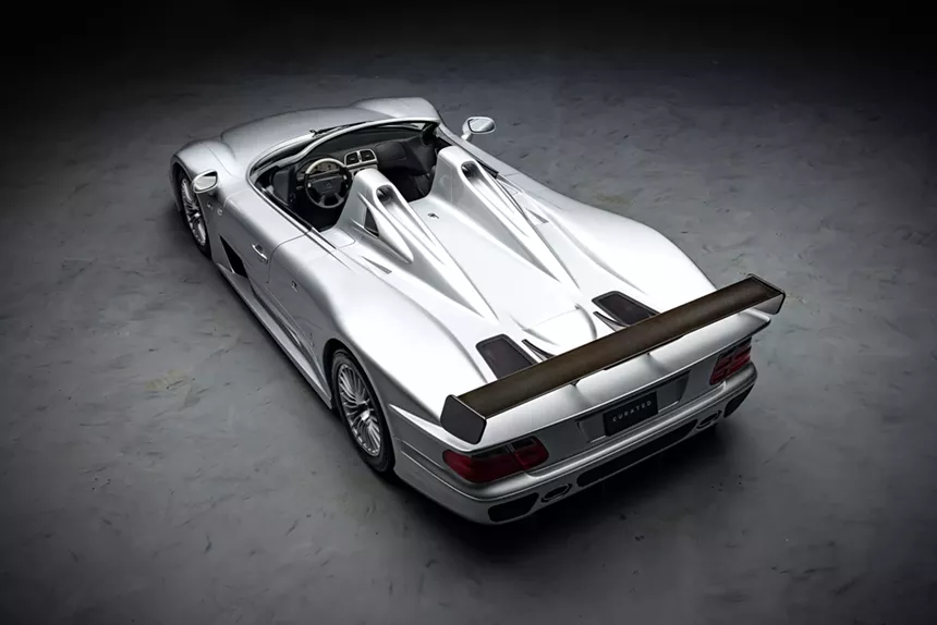 Rear angle of the Mercedes-Benz AMG CLK GTR Roadster, emphasizing the rear wing and taillights