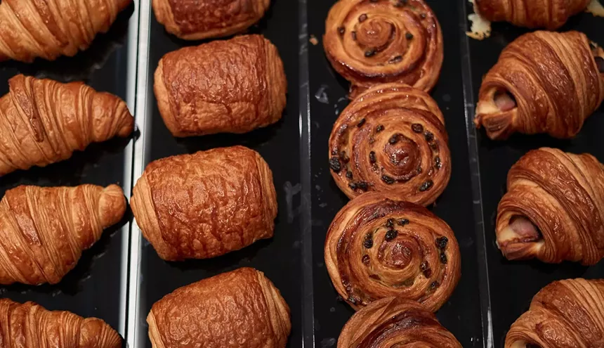 croissants and pastries on black surface