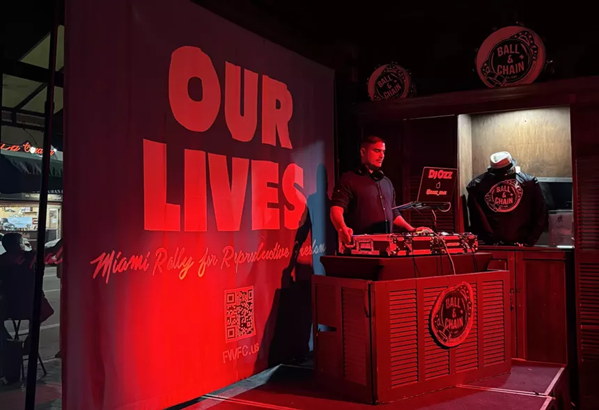 DJ on stage at the election watch party inside Ball & Chain