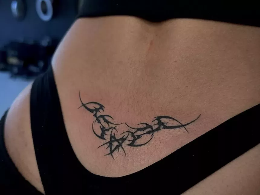 Lower back tattoo on a woman