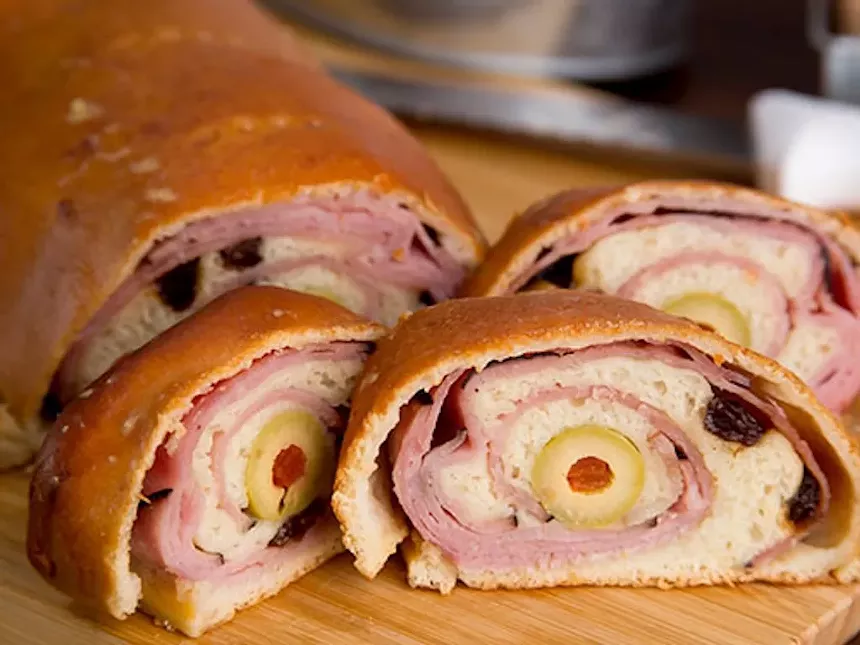bread rolled with ham and olives