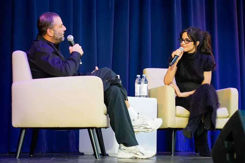 David Grutman and Camila Cabello onstage at the Miami Beach Bandshell