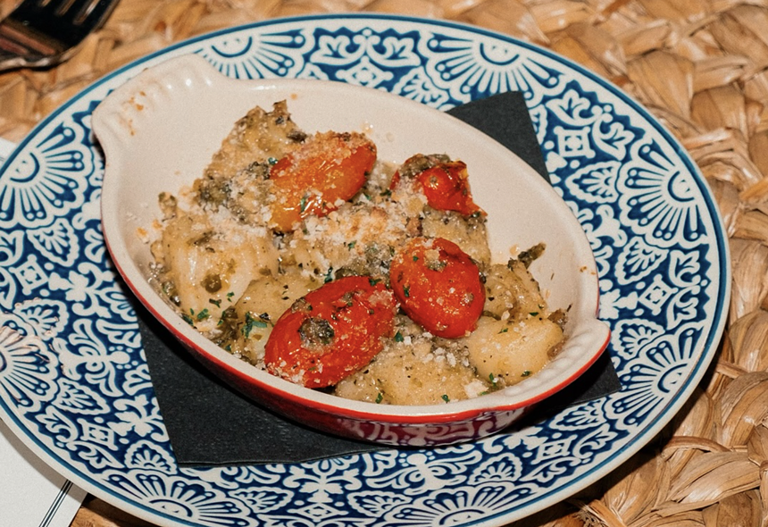 gnocchi and tomatoes in a bowl