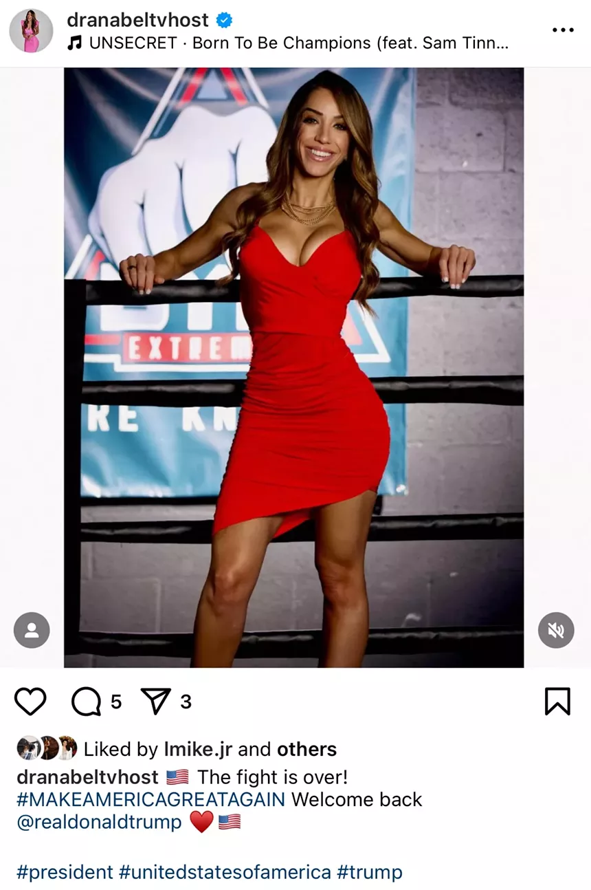 Ana Isabel Hume smiling in a red dress with her back laying against a boxing ring