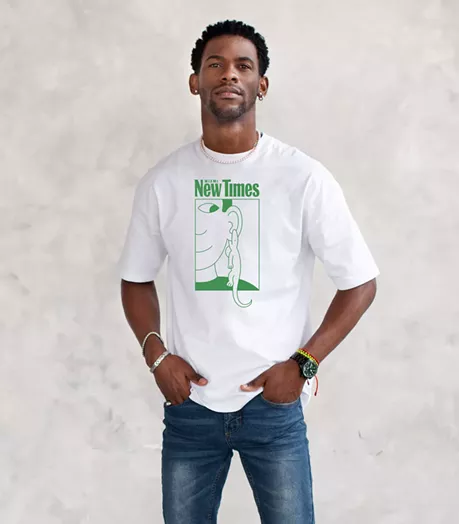 A man wears a white t-shirt with artwork by Gabriel Alcala. The shirt reads "Miami New Times."