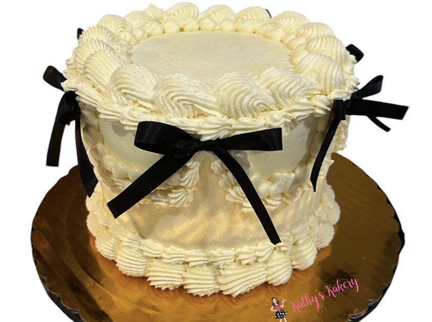a cake with ribbons
