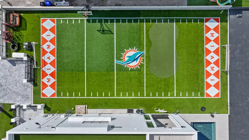 Aerial view of Miami Dolphins football field adjacent to Mike Pouncey's mansion.