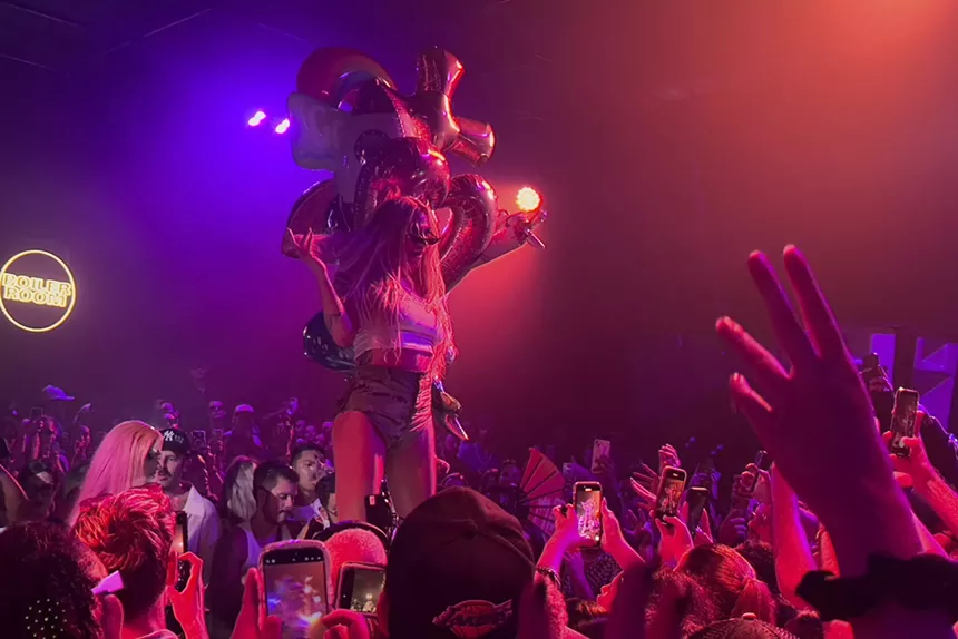 Kesha standing on a table during her Boiler Room set in Miami