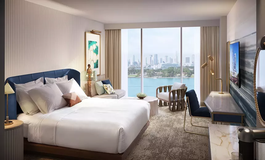 hotel room with skyline and waterfront views