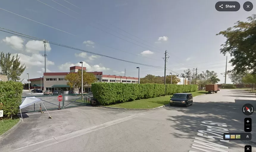 an archived Google Streets image showing a nondescript film studio accessed through an iron gate