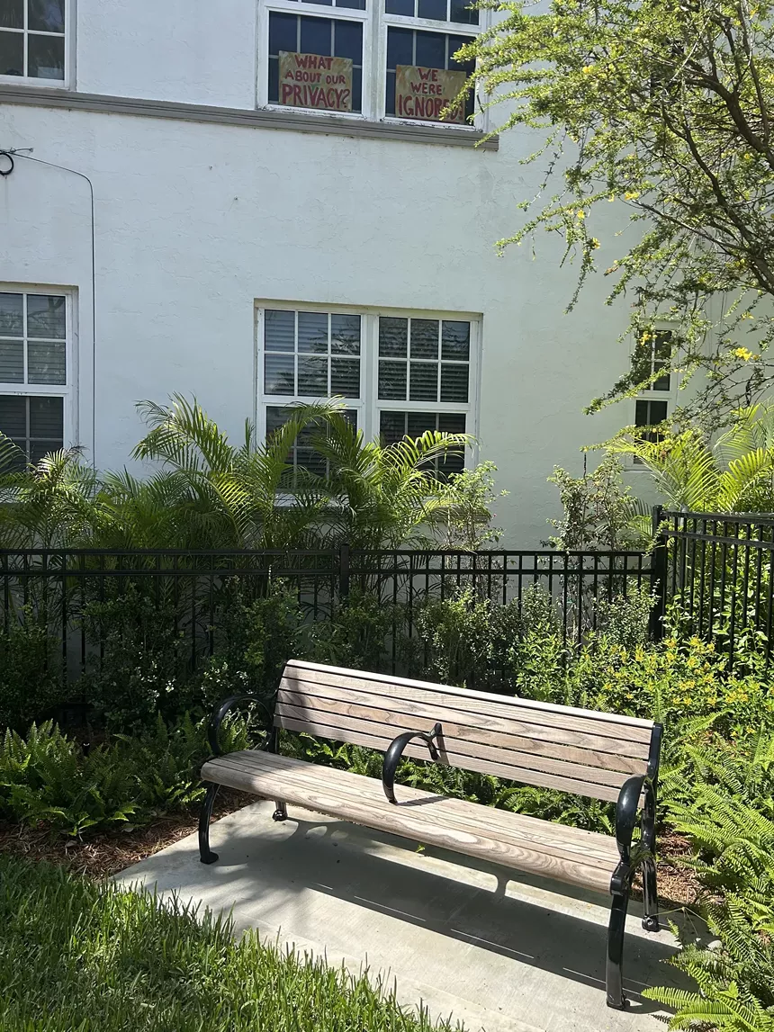 The bench outside the building's window