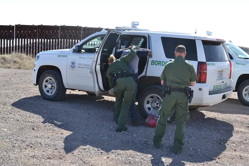 Border Patrol arrests a migrant who had jumped over the border fence near Nogales on February 12, 2019.