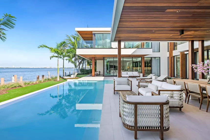 Infinity pool and outdoor living areas at modern mansion
