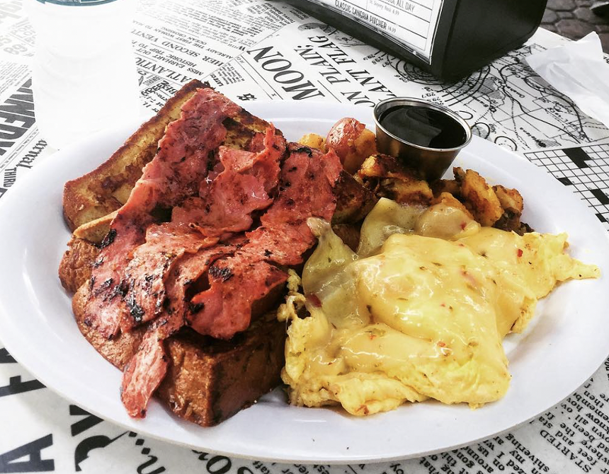 Eggs, bacon, and French toast on a plate