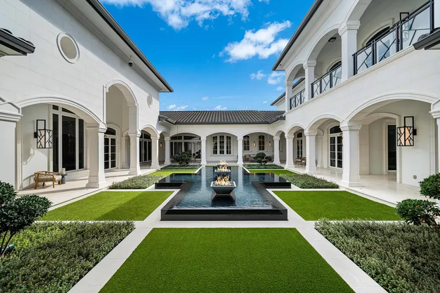 The estate's interior courtyard with a fountain in the center.