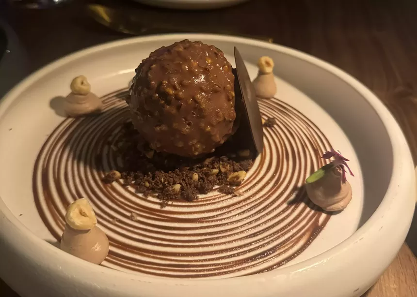 a chocolate dessert on a white plate