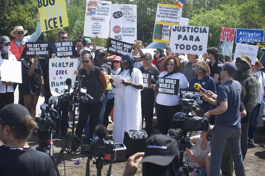Protesters gather outside Alligator Alcatraz.
