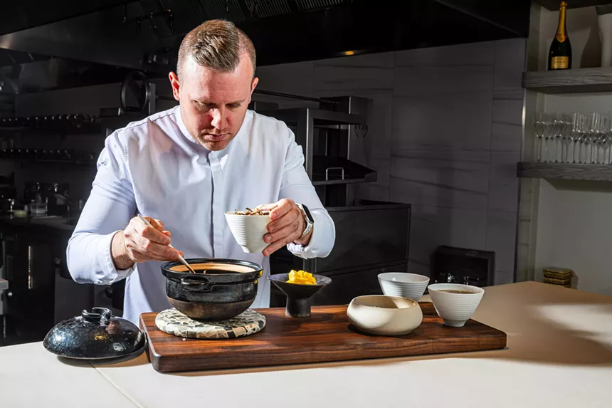 Michelin-strarred chef Ryan Ratino cooks food in a pan.