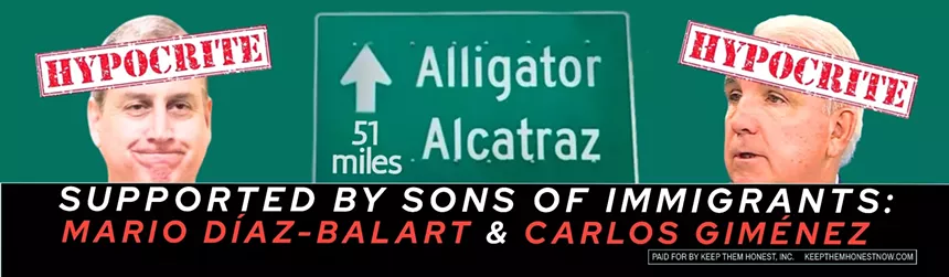 An electronic sign calls out Miami-Dade County politicians over support for Alligator Alcatraz.
