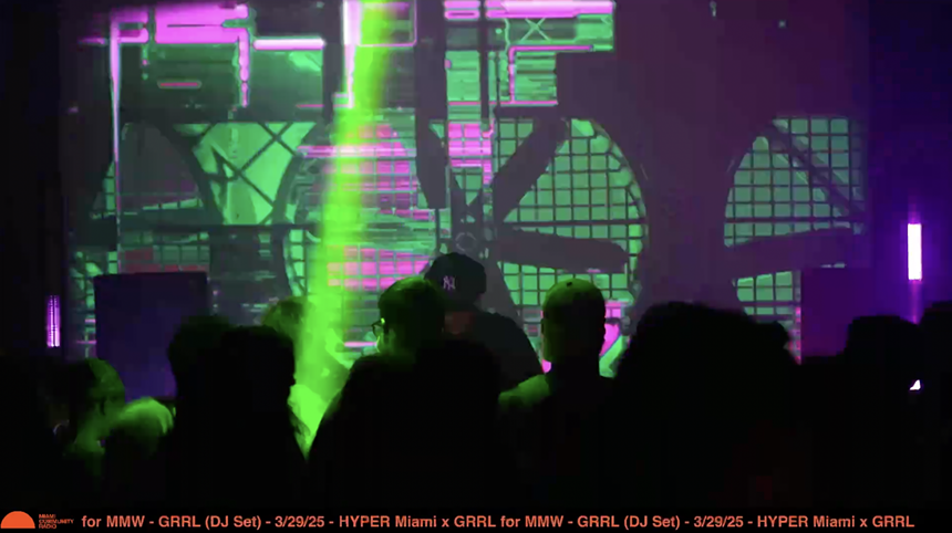 picture of a rave with colorful lights