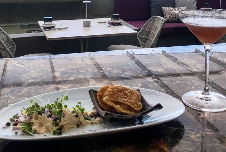 a platter of food on a wooden table